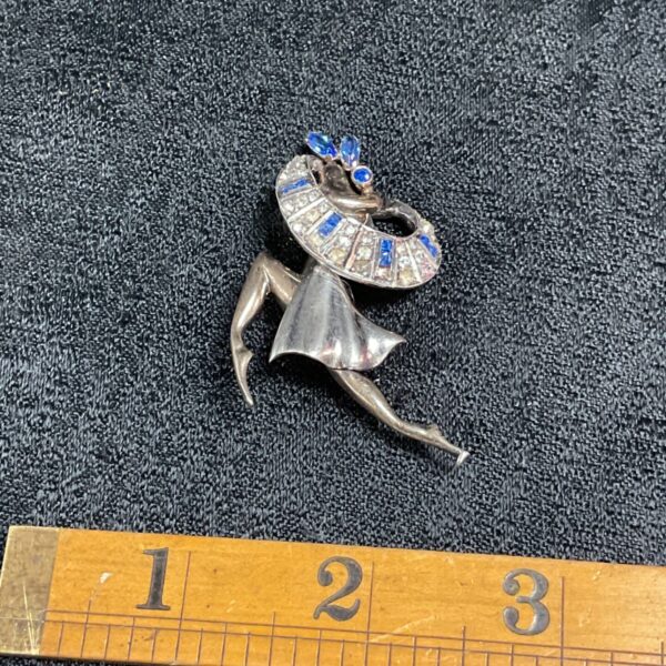 Vintage sterling silver ballerina brooch with blue and white stones.