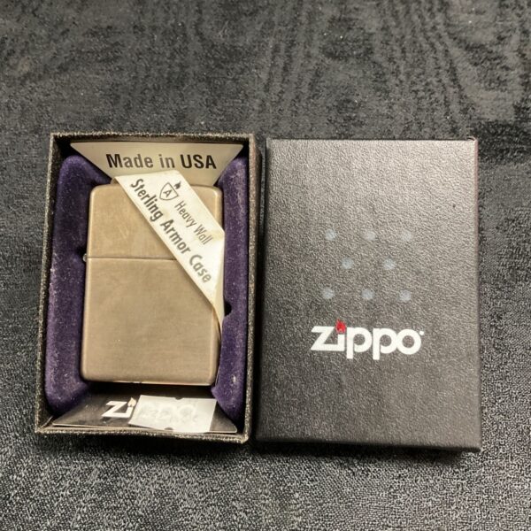 Sterling silver Zippo Armor lighter in black presentation box with purple insert