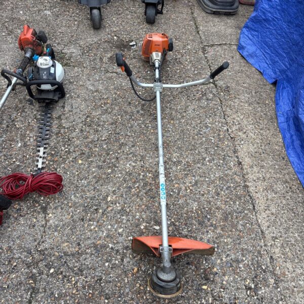 Used Stihl FS 80 petrol strimmer for garden maintenance.