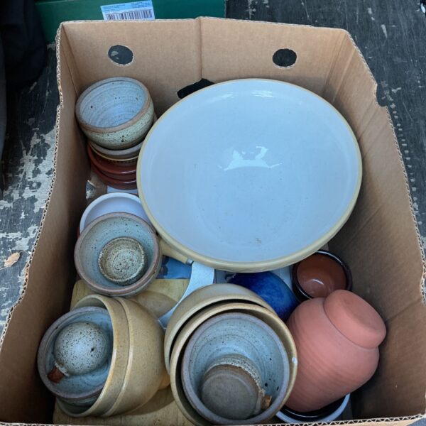 Vintage stoneware bowls collection, including a large mixing bowl.