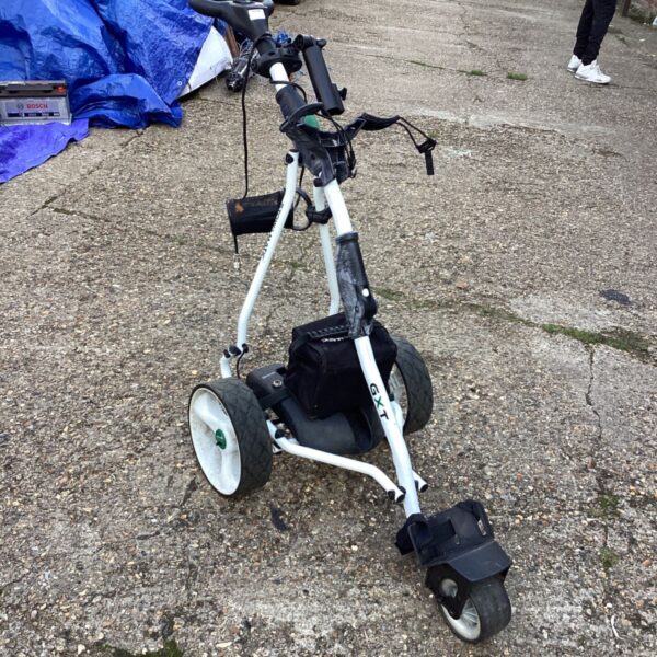 Stowmatic electric golf trolley with battery and charger.