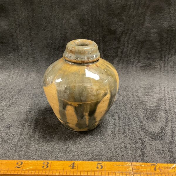 Small studio pottery stoneware bottle with a glazed finish.