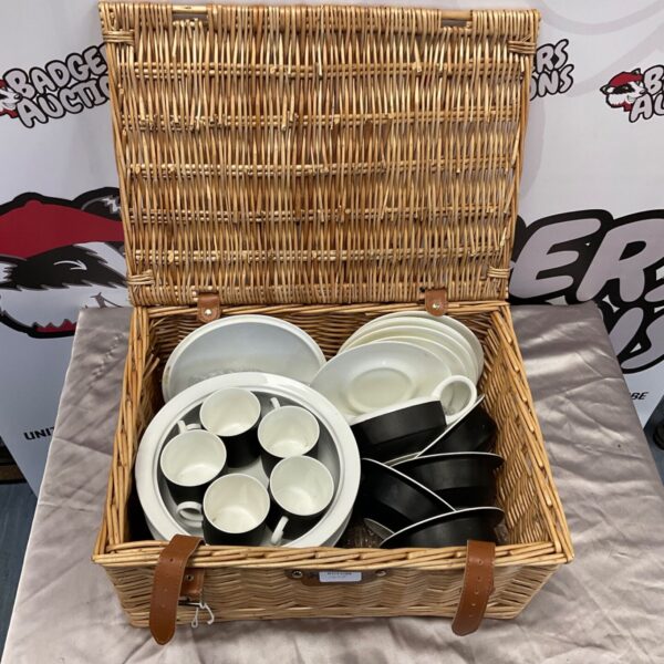 Susie Cooper black and white pottery cups and saucers in wicker basket