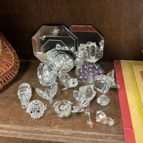 Selection of faceted Swarovski-style crystal animals and figurines with mirrored boxes