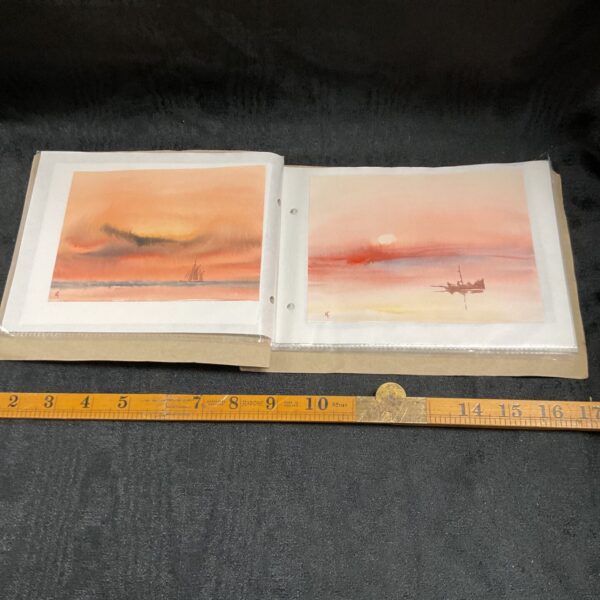 Pair of T Castle watercolours showing orange sunset and pink sun over sea