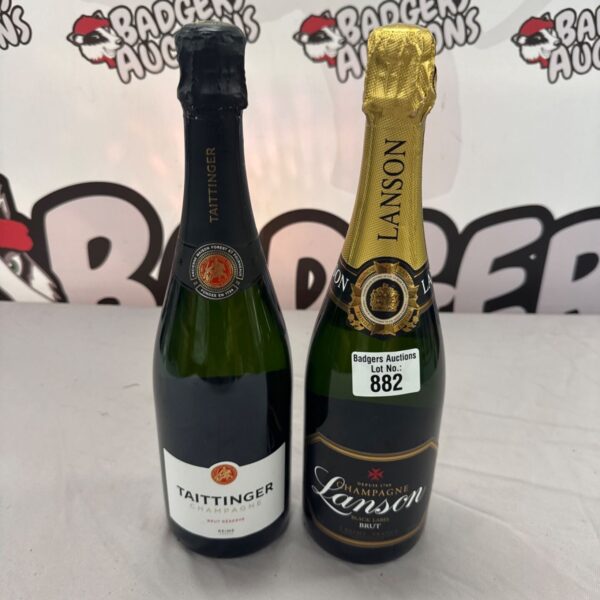 Bottles of Taittinger and Lanson champagne for sale.