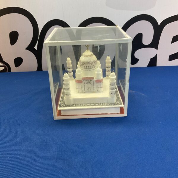 Detailed Taj Mahal model displayed in a clear plastic case.