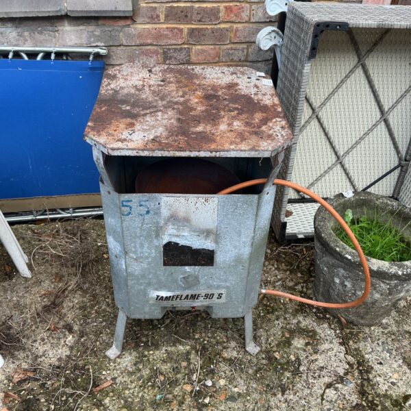Tameflame 90'S galvanised gas heater with rusted top and gas hose attached