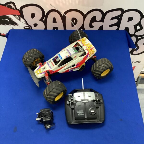 Vintage Tamiya RC Mad Bull monster truck with remote control.