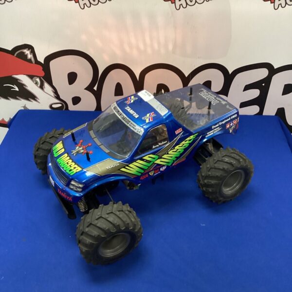 Blue Tamiya RC monster truck, vintage radio control vehicle.