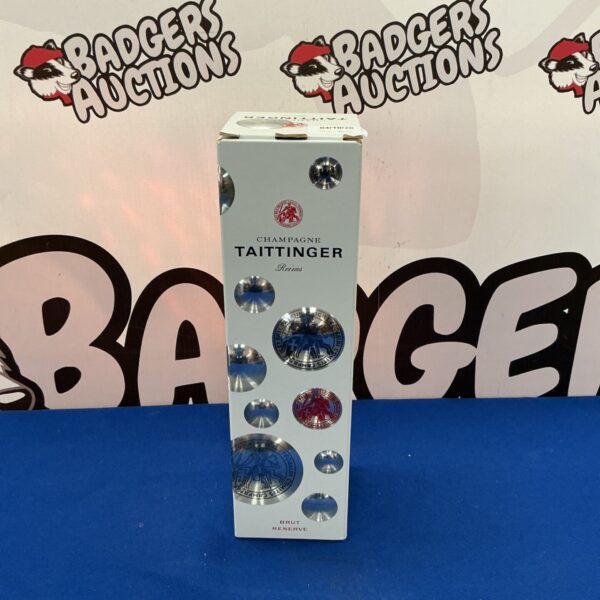 Tattinger Champagne box with branding, collectible alcohol presentation.