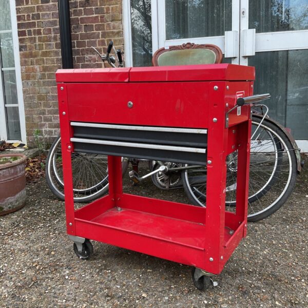 Red TAYG metal engineers trolley with sliding top and two drawers on castors
