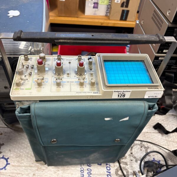 Vintage Tektronix 2213 oscilloscope with controls and display.