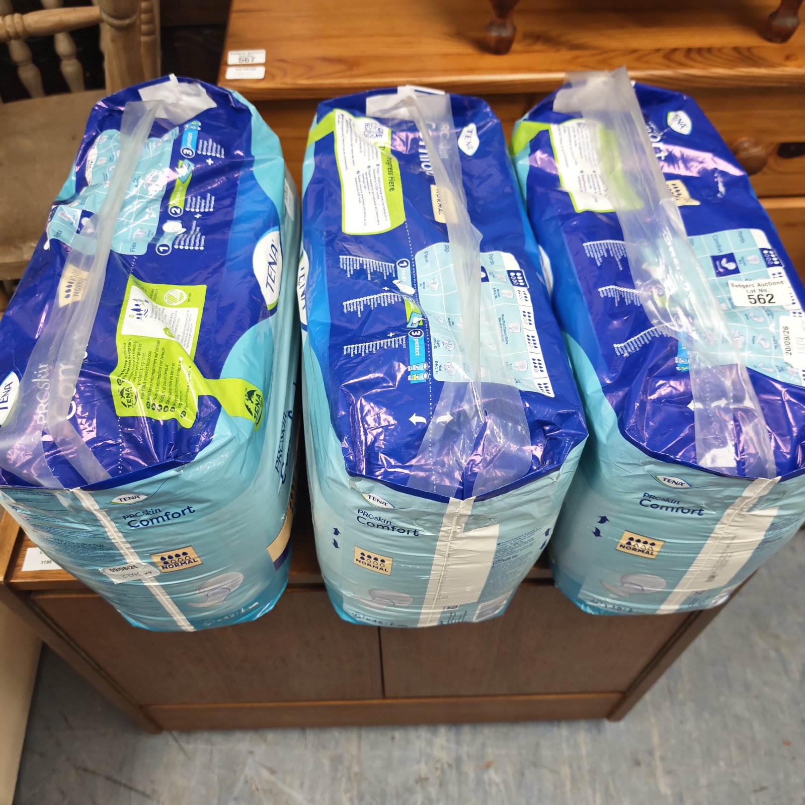Three sealed packs of Tena ProSkin Comfort pads, normal absorbency, in blue packaging