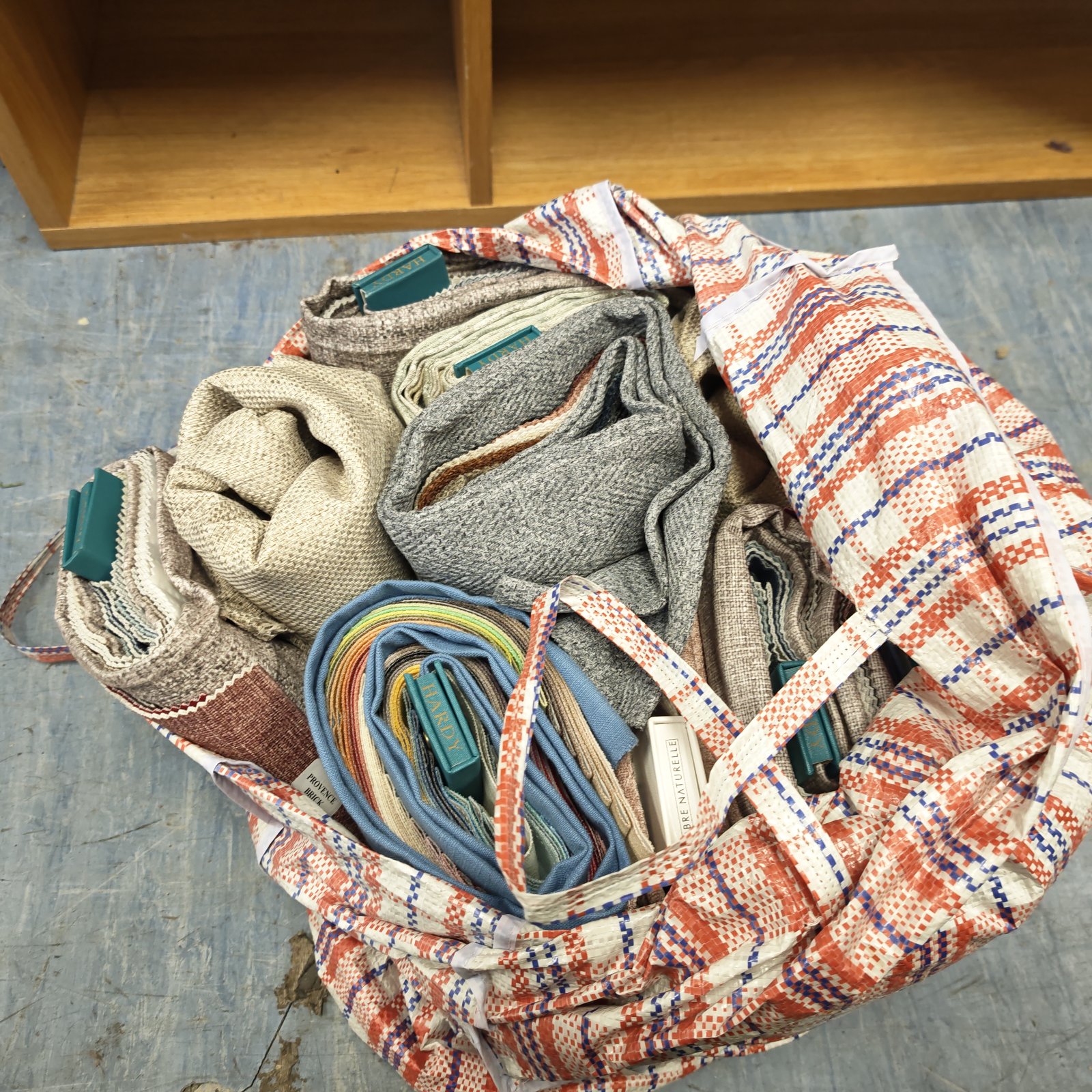 Collection of hardy textile sample packs for interior design.