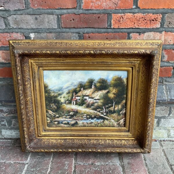 Vintage oil painting of a thatched cottage and ducks.