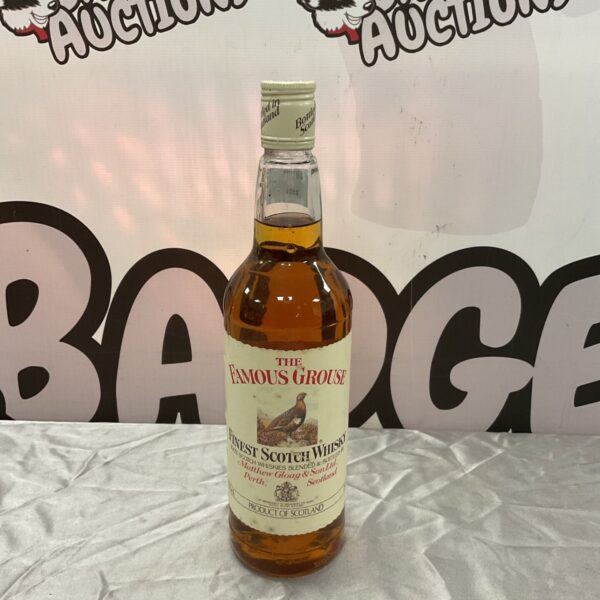 Sealed bottle of The Famous Grouse Finest Scotch Whisky with cream grouse label