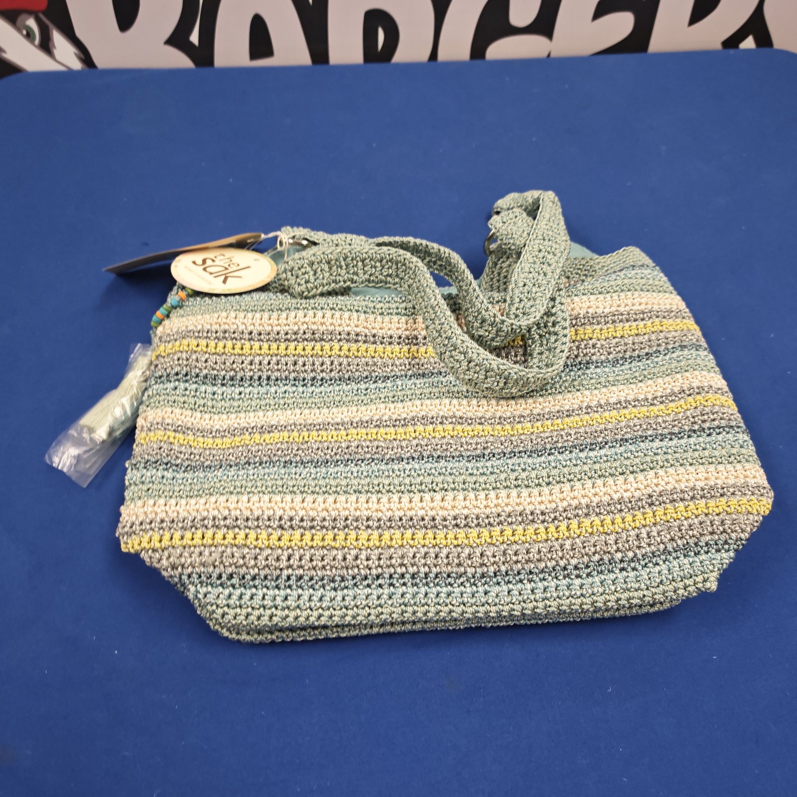 The Sak hand crocheted ladies bag with striped green and cream crochet body