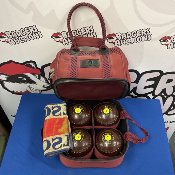 Vintage Thomas Taylor lawn bowls set with red EMSMORN carry bag.