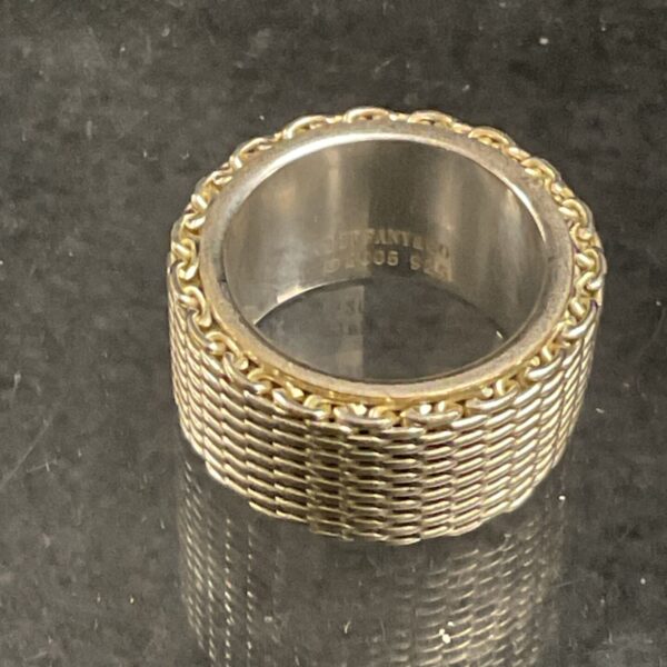 Tiffany and Co silver ring with a woven band design.