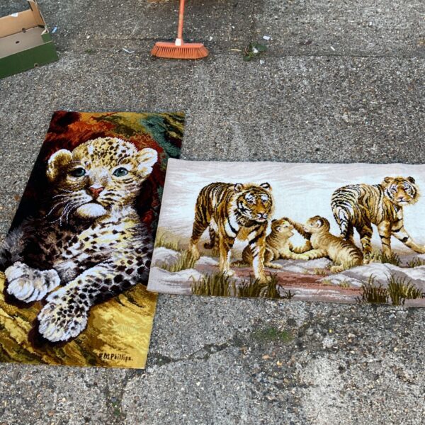 Vintage tiger and leopard cub rugs, colourful wall hangings.