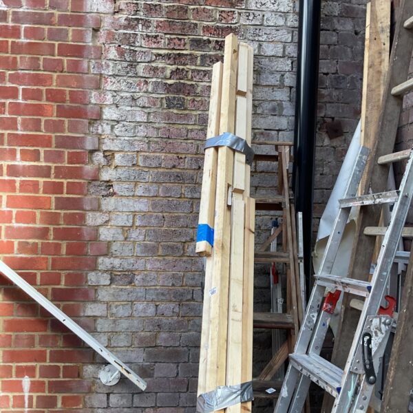 Bundle of mixed lengths timber for DIY projects and construction.