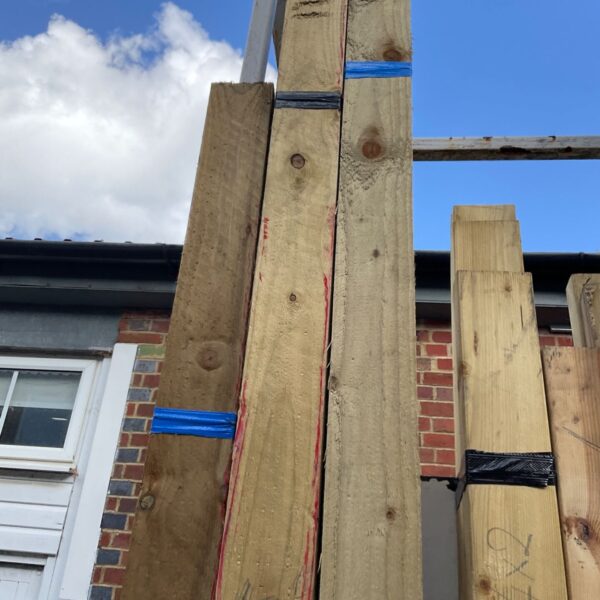 Stack of three timber bundles ready for construction projects.