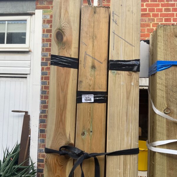 Three bundles of 7ft timber secured with black strapping.
