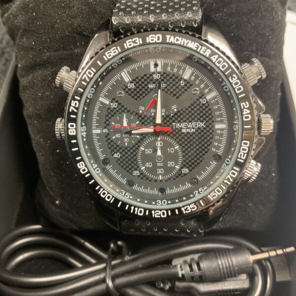 Close-up of the TimeWerk Berlin spy camera watch face.