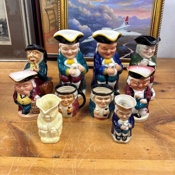 Vintage Toby character jugs, including Burlington ware, displayed together.