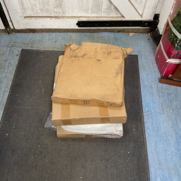 Boxed lot of four toilet seats for bathroom renovation.