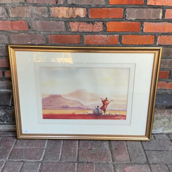 Framed Tony Hudson print of an African landscape with tribal figures.