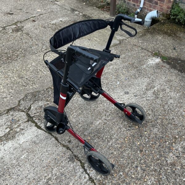 Topro Trojan mobility walker with a black seat and red frame.