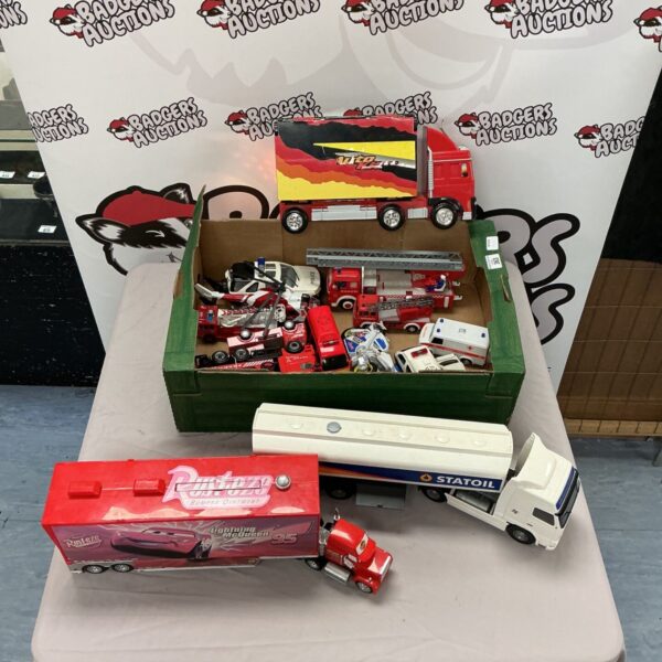 Toy car and truck lot featuring Lightning McQueen and StatOil truck.
