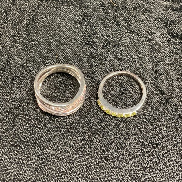 Two 925 silver rings, one with pink stones and one with yellow stones
