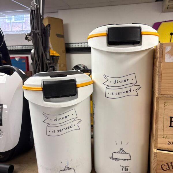 Two white plastic pet food containers with black lids and yellow trim