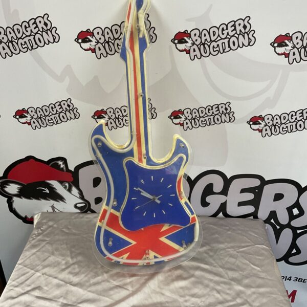 Union Jack guitar-shaped wall clock with tubular outline and blue clock face