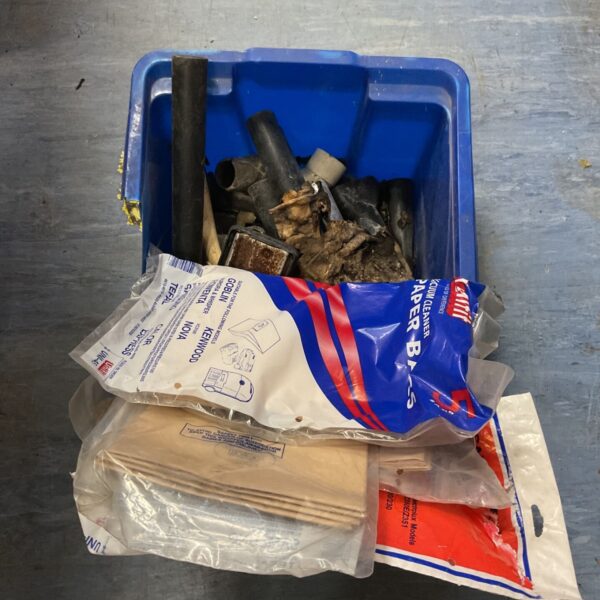Blue tub with hoover accessories and sealed paper vacuum cleaner dust bags