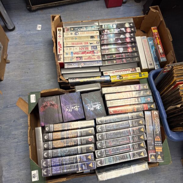 VHS tape collection with box sets, vintage home video.