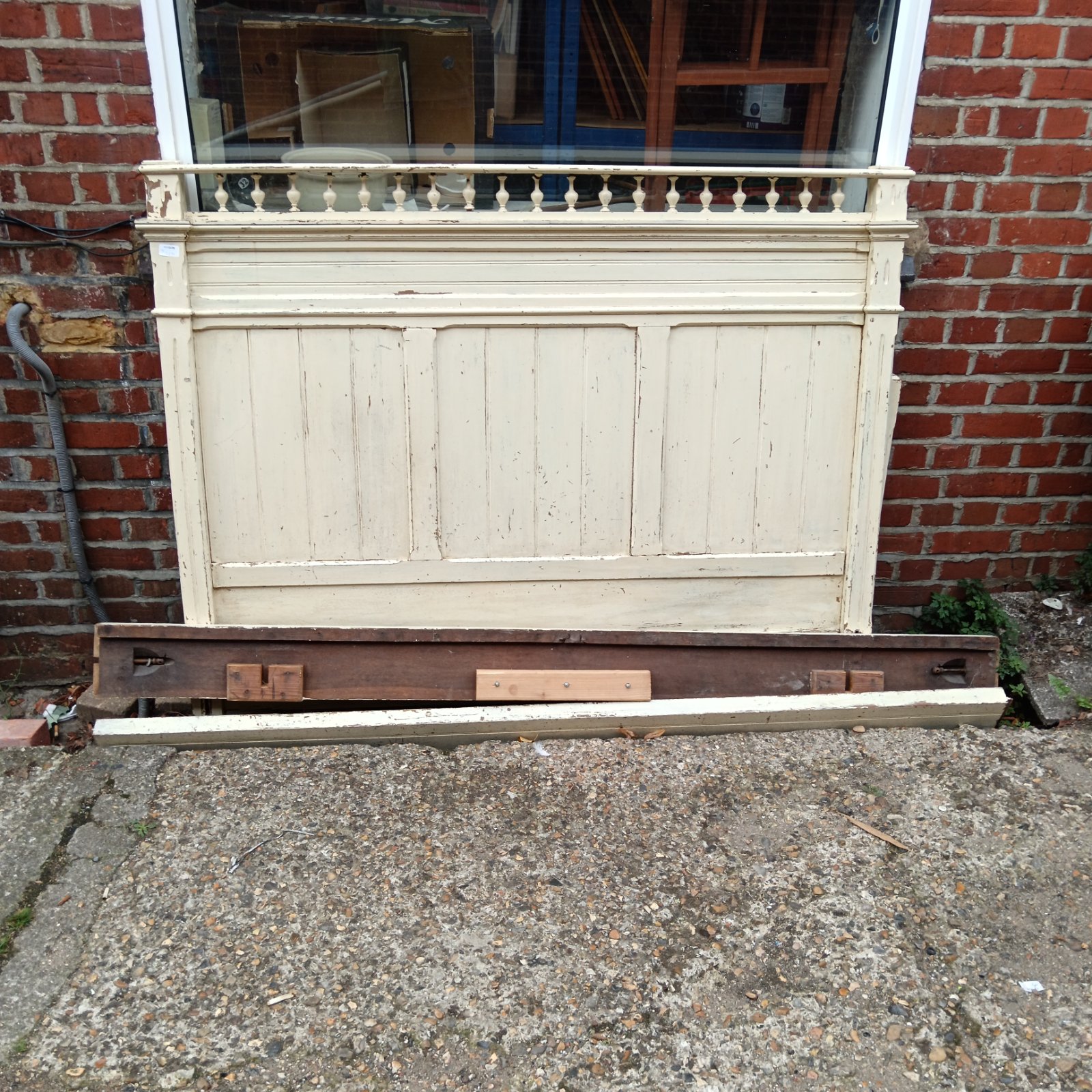 Antique Victorian bed frame headboard with spindle gallery.