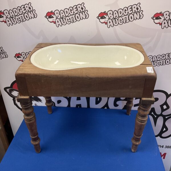 Antique Victorian mahogany bidet table with ceramic bowl.