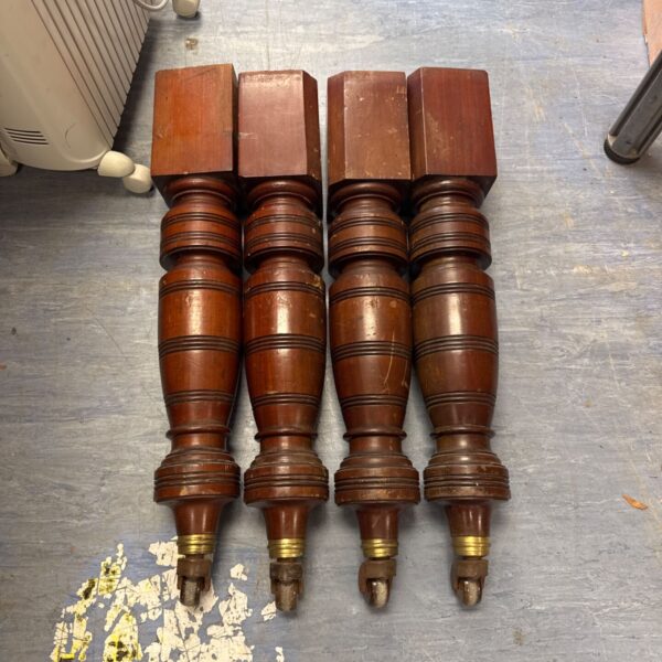 Victorian mahogany table legs with ceramic casters, antique furniture.