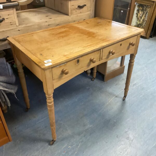 Victorian oak kitchen table with drawer and casters.