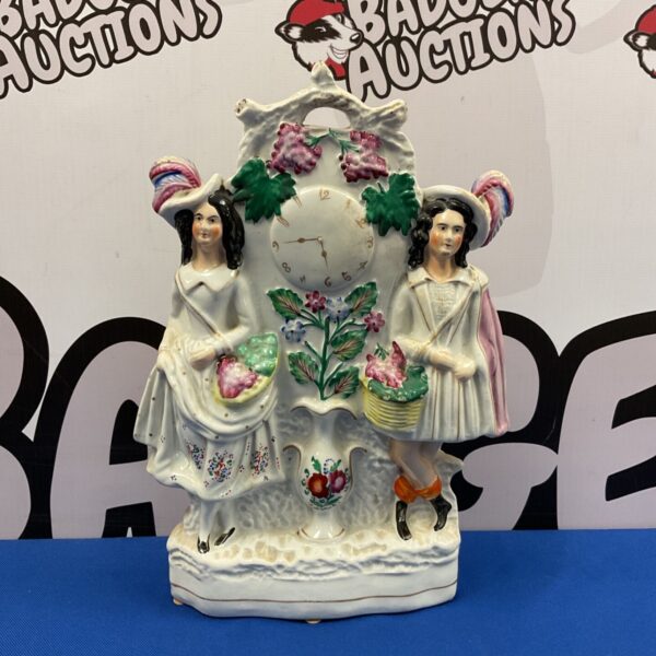 Antique Victorian Staffordshire flatback figurine of a courting couple.