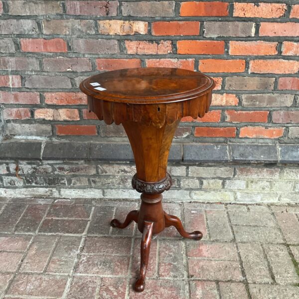 Victorian walnut trumpet sewing work table with circular top and tripod base