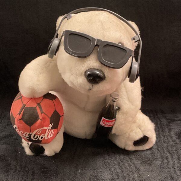 Vintage Coca-Cola polar bear plush with sunglasses, headphones and branded football