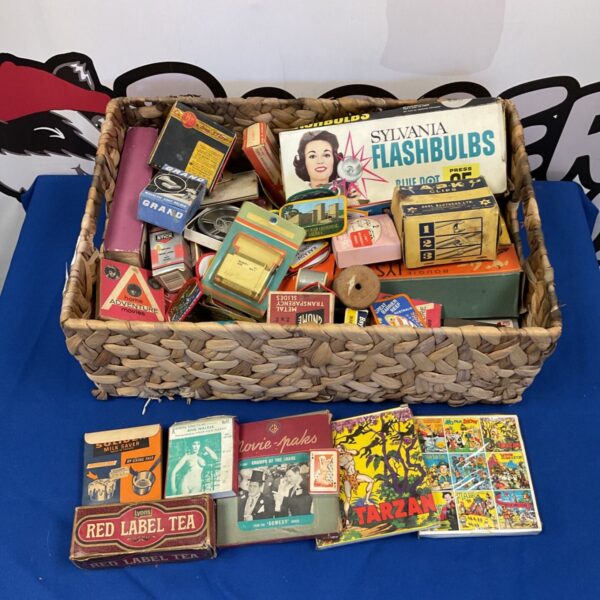 Vintage 8mm film collection with Sylvania flashbulbs and patches.