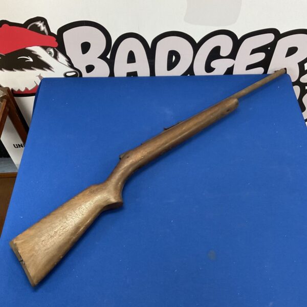 Vintage air rifle with wooden stock, ideal for restoration.