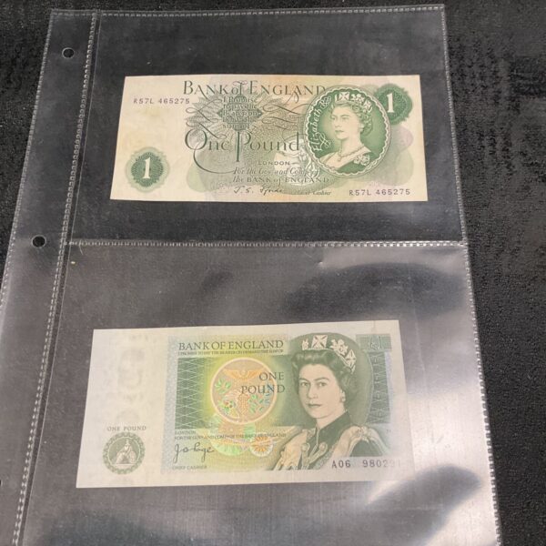 Front of two vintage Bank of England one pound notes in protective sleeves