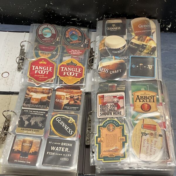 Vintage beer mats collection in a ring binder folder.